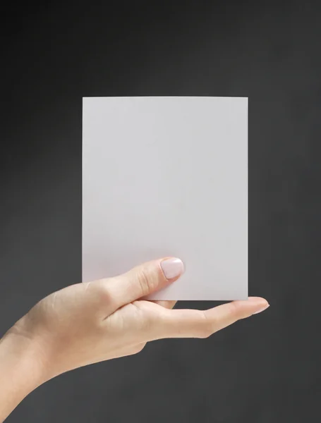 Stock image Hand holding white card