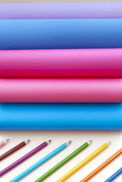 stock image Colored paper and pencils