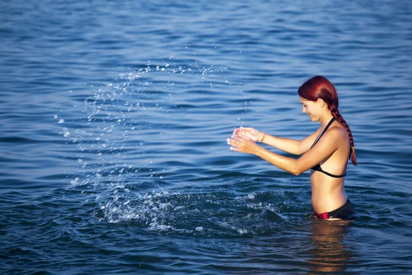 stock image Young woman relaxing in sea