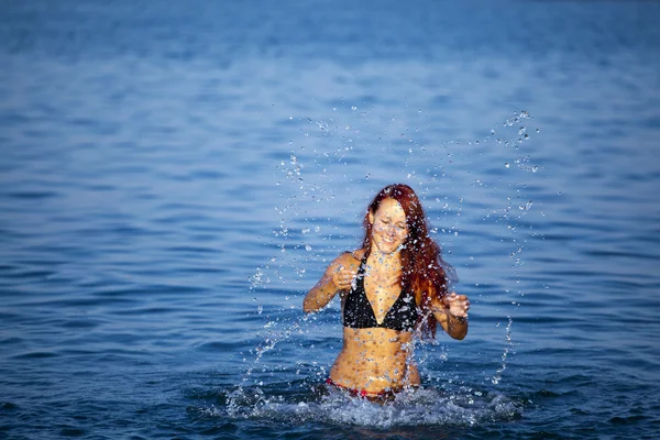 stock image Young woman relaxing in sea