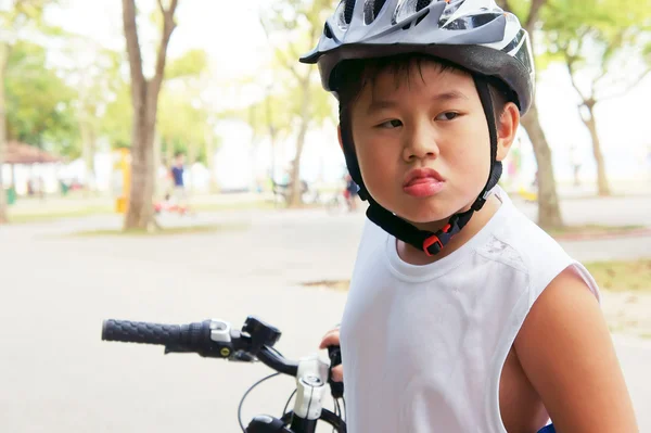 Cycling boy stick out tongue — Stock Photo, Image