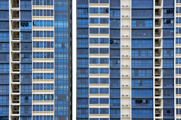 Huge resident apartment building with blue glass