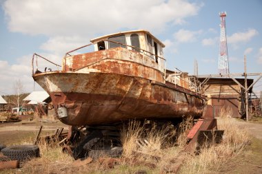 An old rusty ship on dry land