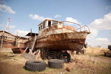 An old rusty ship on dry land