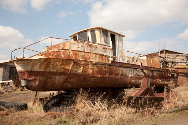 stock image An old rusty ship on dry land