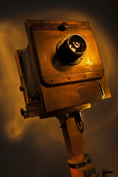 Old camera on a black background — Stock Photo, Image