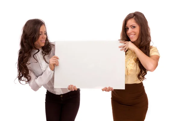 Gemini sisters hold a poster on a white background Stock Photo
