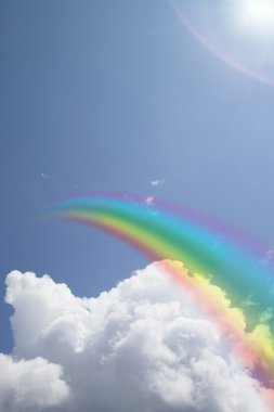 Rainbow and cloud in blue sky clipart