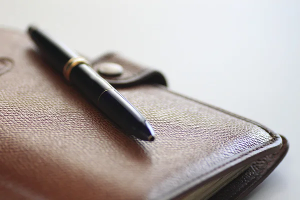 Personal organizer and pen — Stock Photo, Image