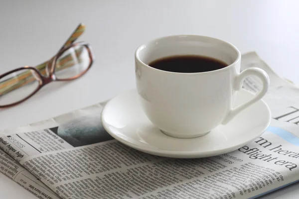 Stock image Coffee and newspaper