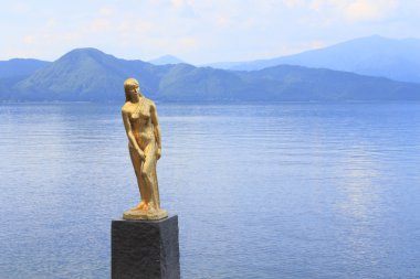 Statue Tatsuko in lake Tazawa clipart