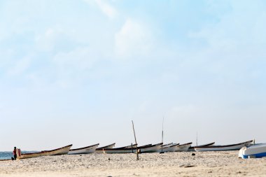 Boats on the beach of tulum clipart