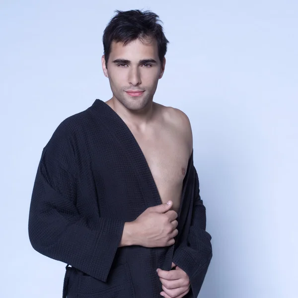 Handsome man in a bathrobe — Stock Photo, Image