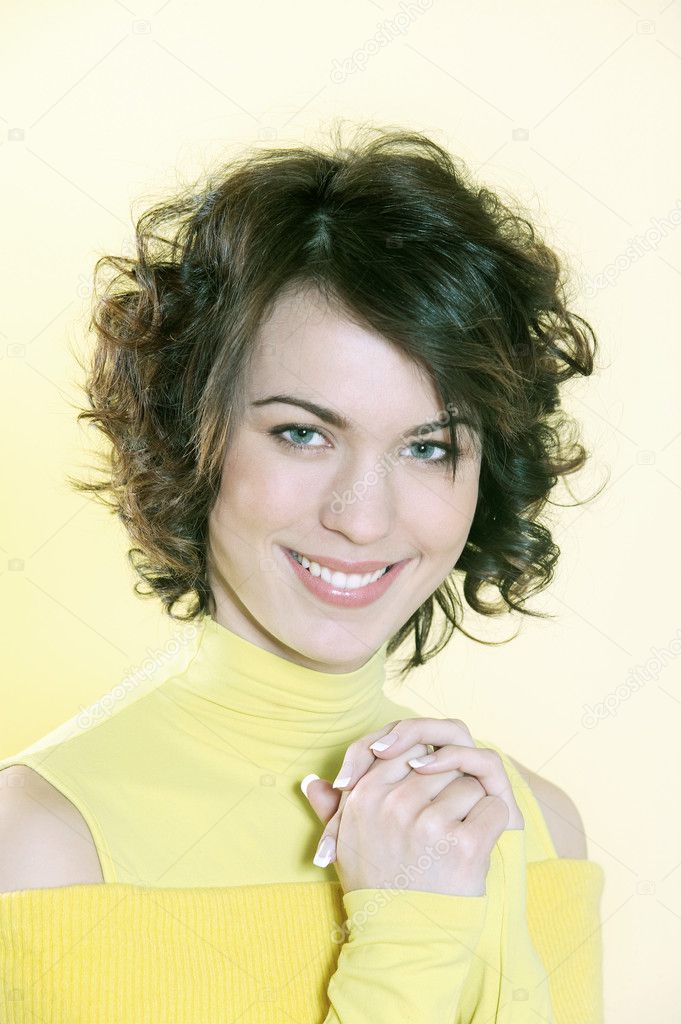 Portrait of a young beautiful brunette woman toothy smile