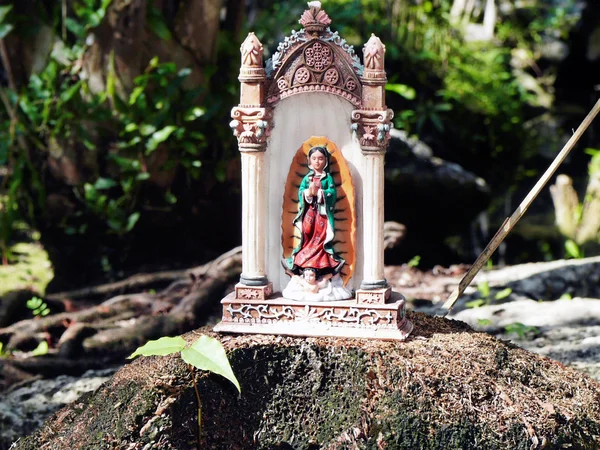 Small mexican virgin mary statue — Stock Photo, Image