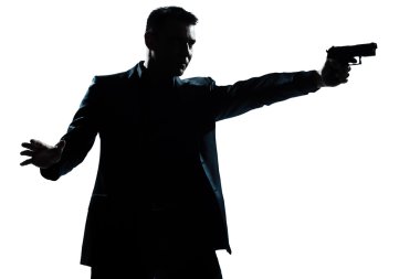 Silhouette man portrait with gun aiming clipart