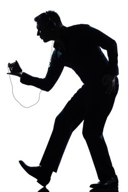 Silhouette man full length dancing happy listening to music clipart