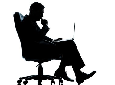 One business man computer computing serious sitting in armchair clipart