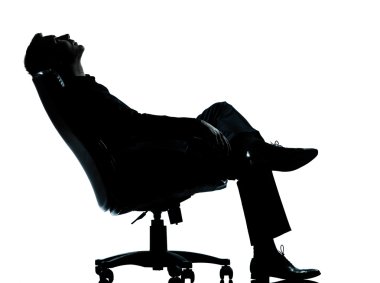 One business man sitting in armchair relaxing thinking silhouett clipart