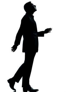 One business man walking looking up silhouette clipart