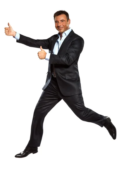 Un hombre de negocios corriendo saltando pulgares dobles hacia arriba —  Fotos de Stock