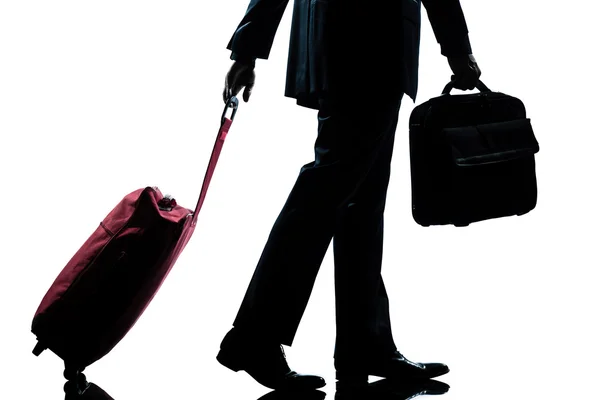Business traveler man walking with handbag and suitcase — Stock Photo, Image
