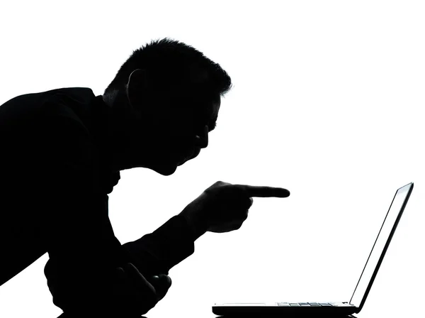 Egy üzleti ember sziluettje, számítástechnika, számítógép laptop mutat — Stock Fotó
