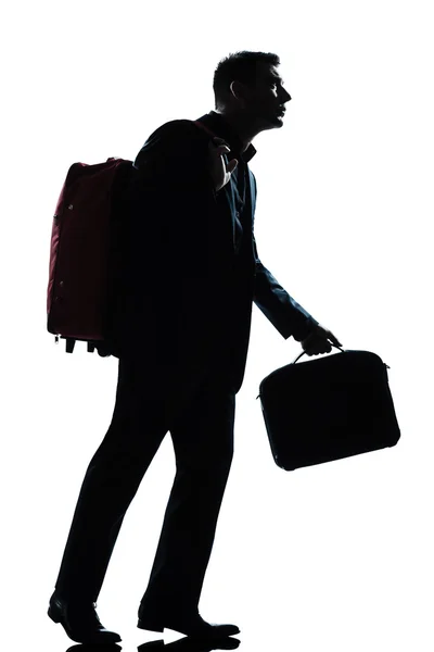 Business traveler man walking with suitcase on shoulders — Stock Photo, Image