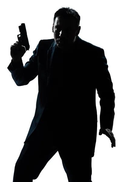 Silhouet man portret met pistool — Stockfoto