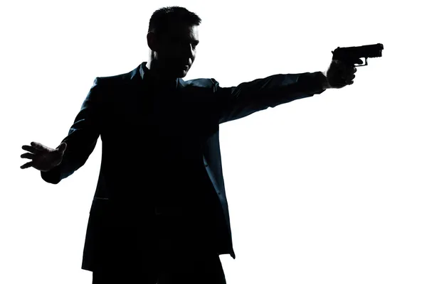 Retrato de homem silhueta com arma apontando — Fotografia de Stock