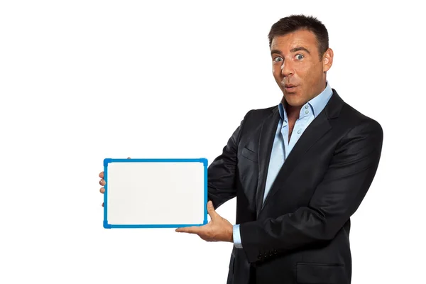 Um homem de negócios segurando mostrando quadro branco — Fotografia de Stock
