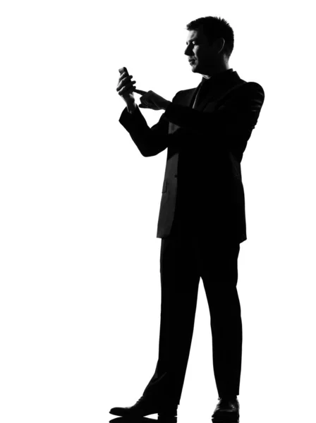 Silhouette man on the phone sms text messaging — Stock Photo, Image