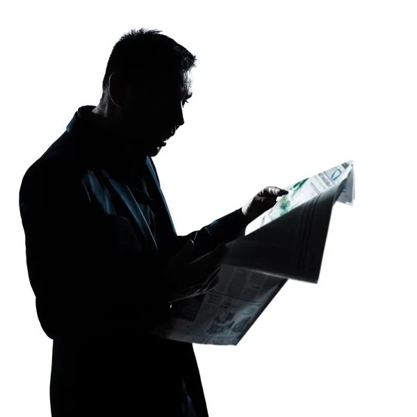 Silhouette man portrait reading newspaper surprised — Stock Photo, Image