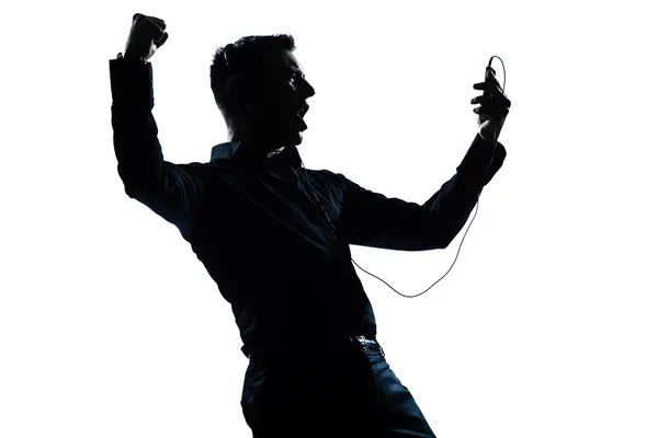 Чоловік силует портрет щасливий прослуховування музики — стокове фото