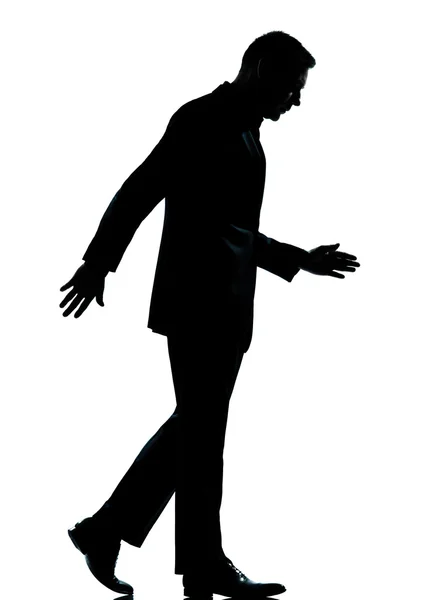 One business man walking looking down silhouette — Stock Photo, Image