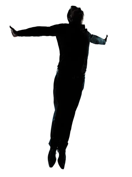 Ein Geschäftsmann springt fliegende Wellness-Silhouette — Stockfoto
