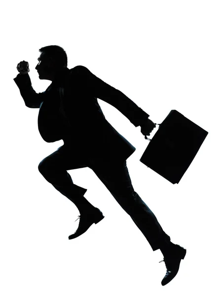 Um homem de negócios pulando correndo silhueta — Fotografia de Stock