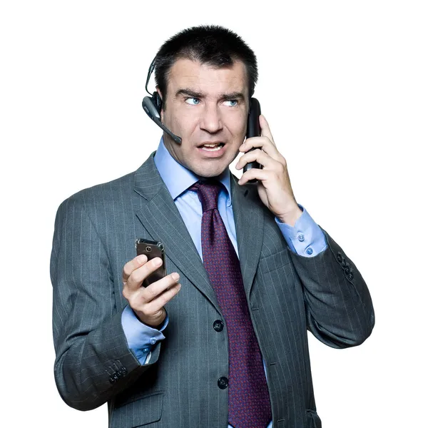Бізнесмен зайнятий декількома телефонами — стокове фото