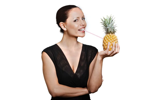 Portrait of beautiful happy woman drinking juice through pineapp — Stock Photo, Image