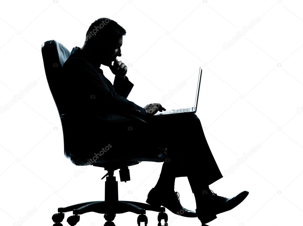 One business man computer computing sitting in armchair silhouet