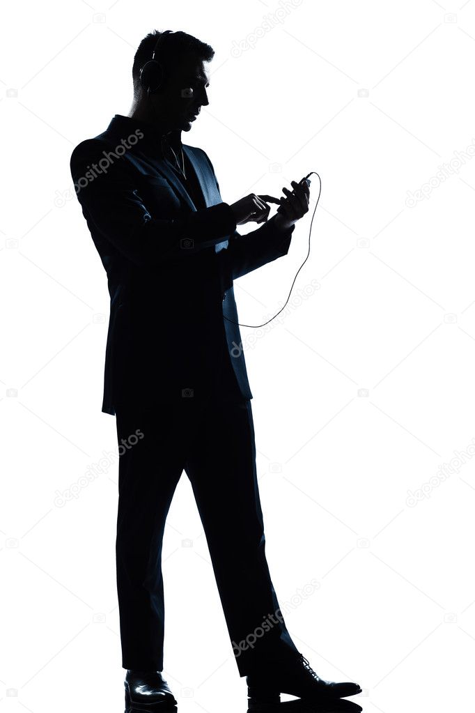 Silhouette man full length text messaging telephone listening to