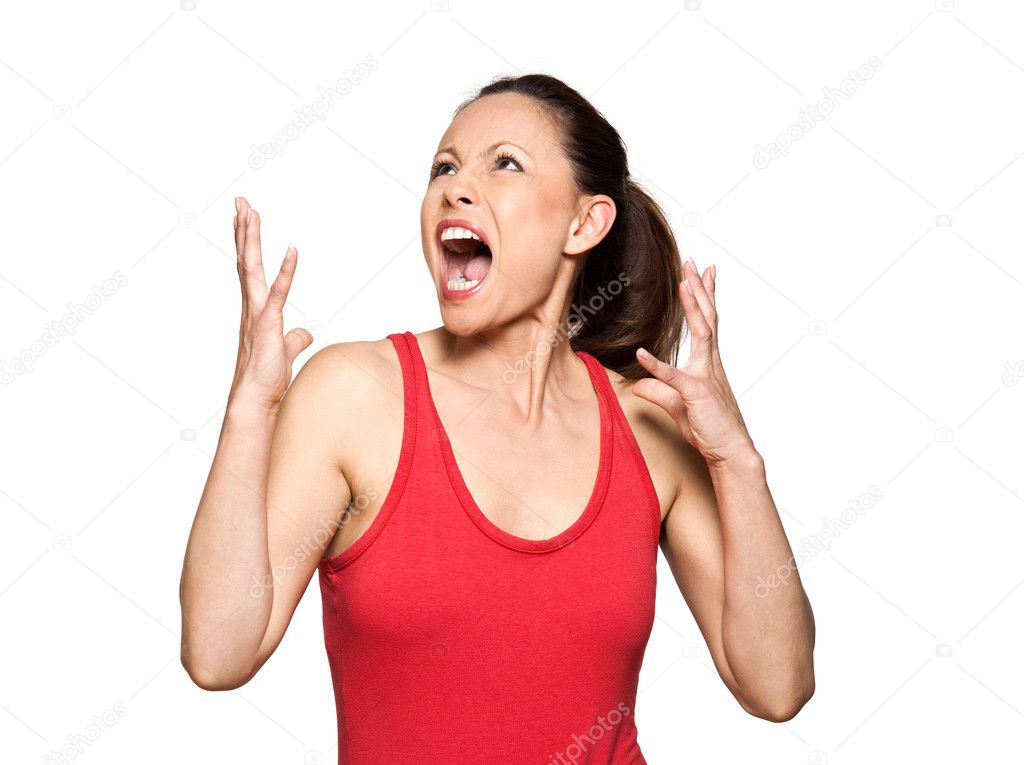 Portrait of expressive angry woman looking up and screaming