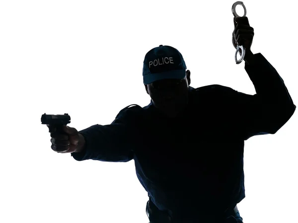 Police officer with handgun and handcuffs — Stock Photo, Image