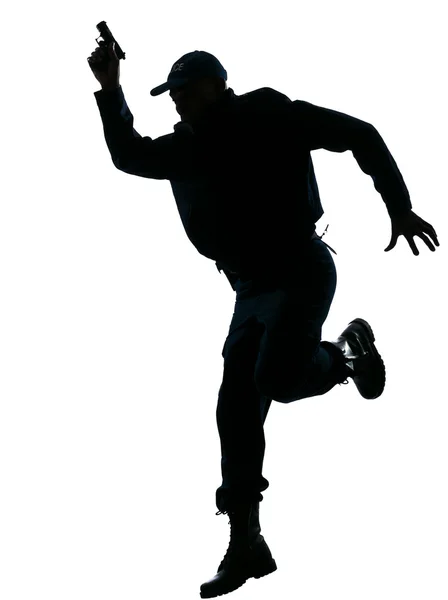 Policial correndo com uma pistola — Fotografia de Stock