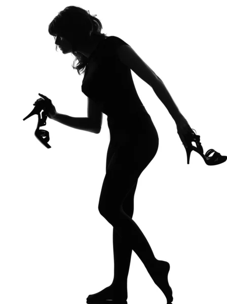 Silhouette woman walking quite barefoot on tiptoe — Stock Photo, Image