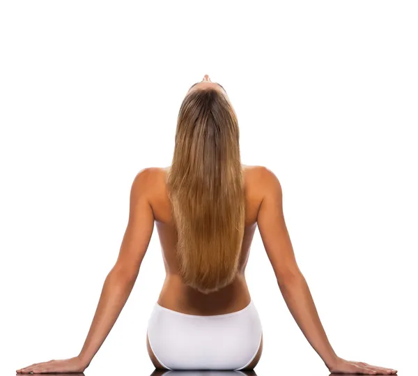 Blond haired woman stretching backwards — Stock Photo, Image