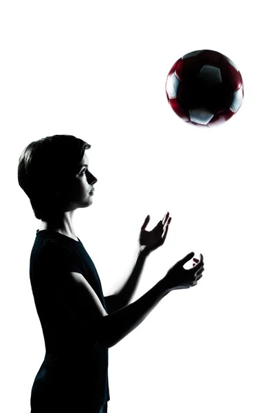 One young teenager boy girl silhouette tossing soccer football — Stock Photo, Image