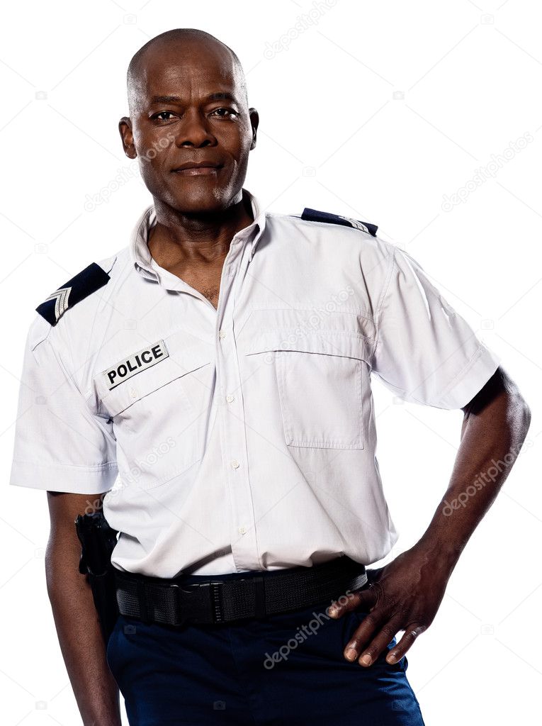 Mature policeman with hand on waist