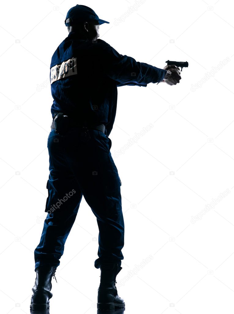 Policeman aiming handgun