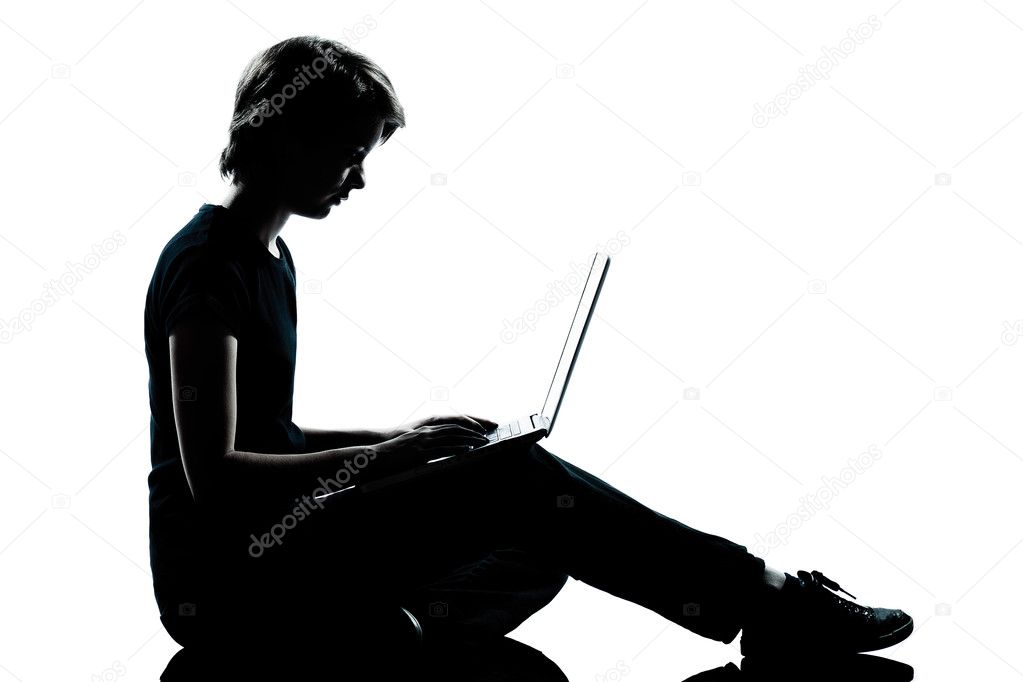 One young teenager boy or girl silhouette computer computing lap